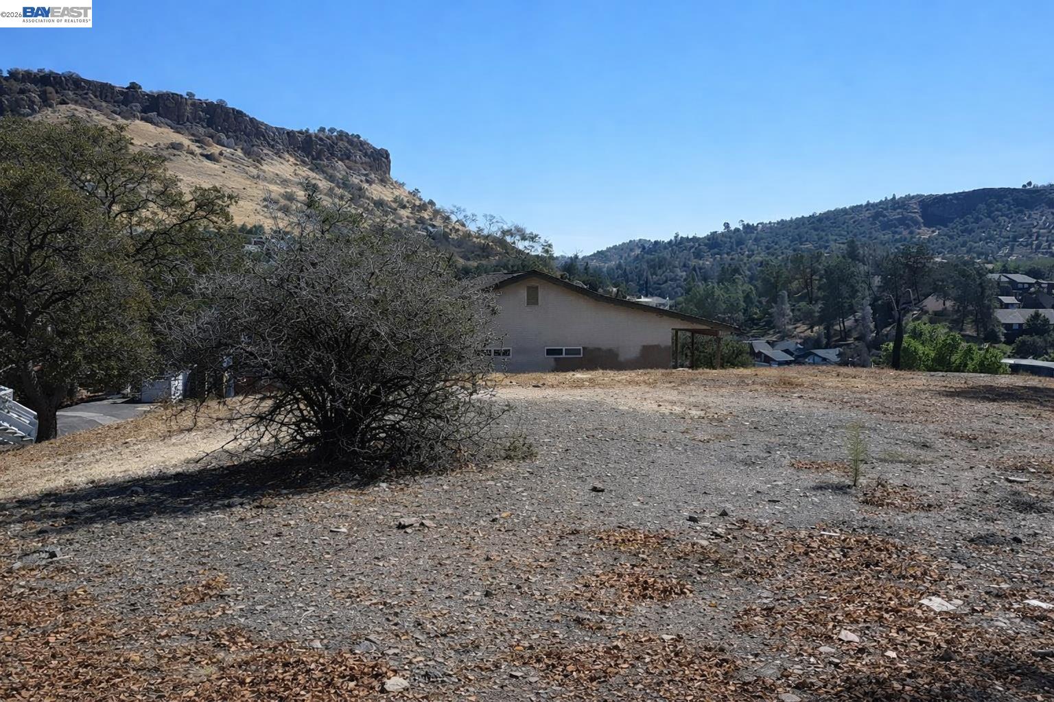 512 Winchester Way Copperopolis, CA 95228 - Photo 2 of 11 a view of dirt road with a mountain in the back