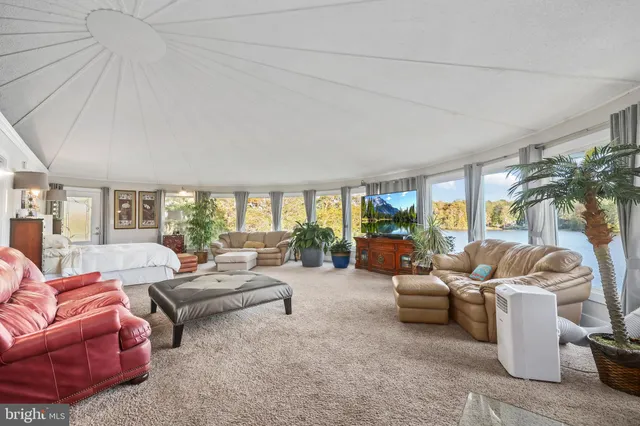 a spacious bathroom with a granite countertop sink mirror and bathtub