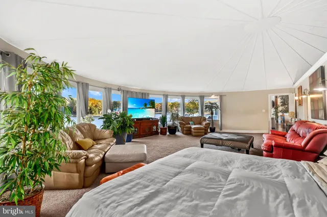 a view of a two chairs in the balcony