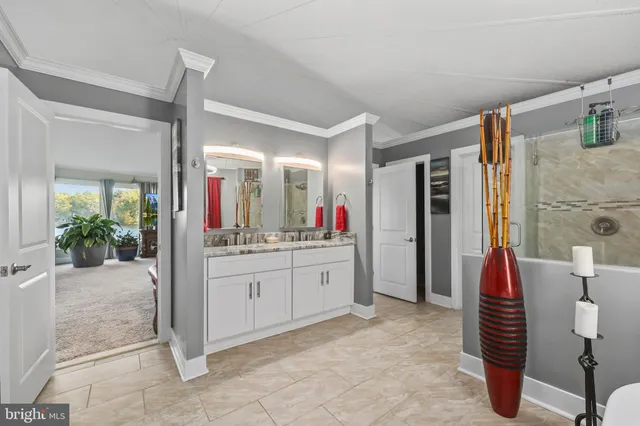 a living room with couch and large window