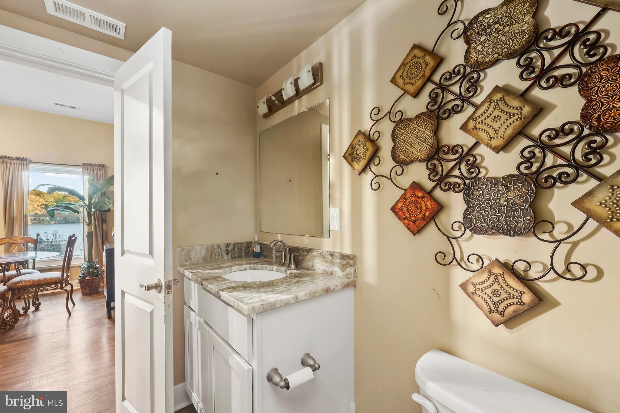 20 Greenvale Court Ruther Glen, VA 22546 - Photo 30 of 65 a bathroom with a granite countertop sink and a mirror