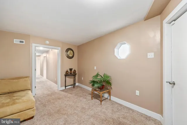 an aerial view of a house with a garden and lake view