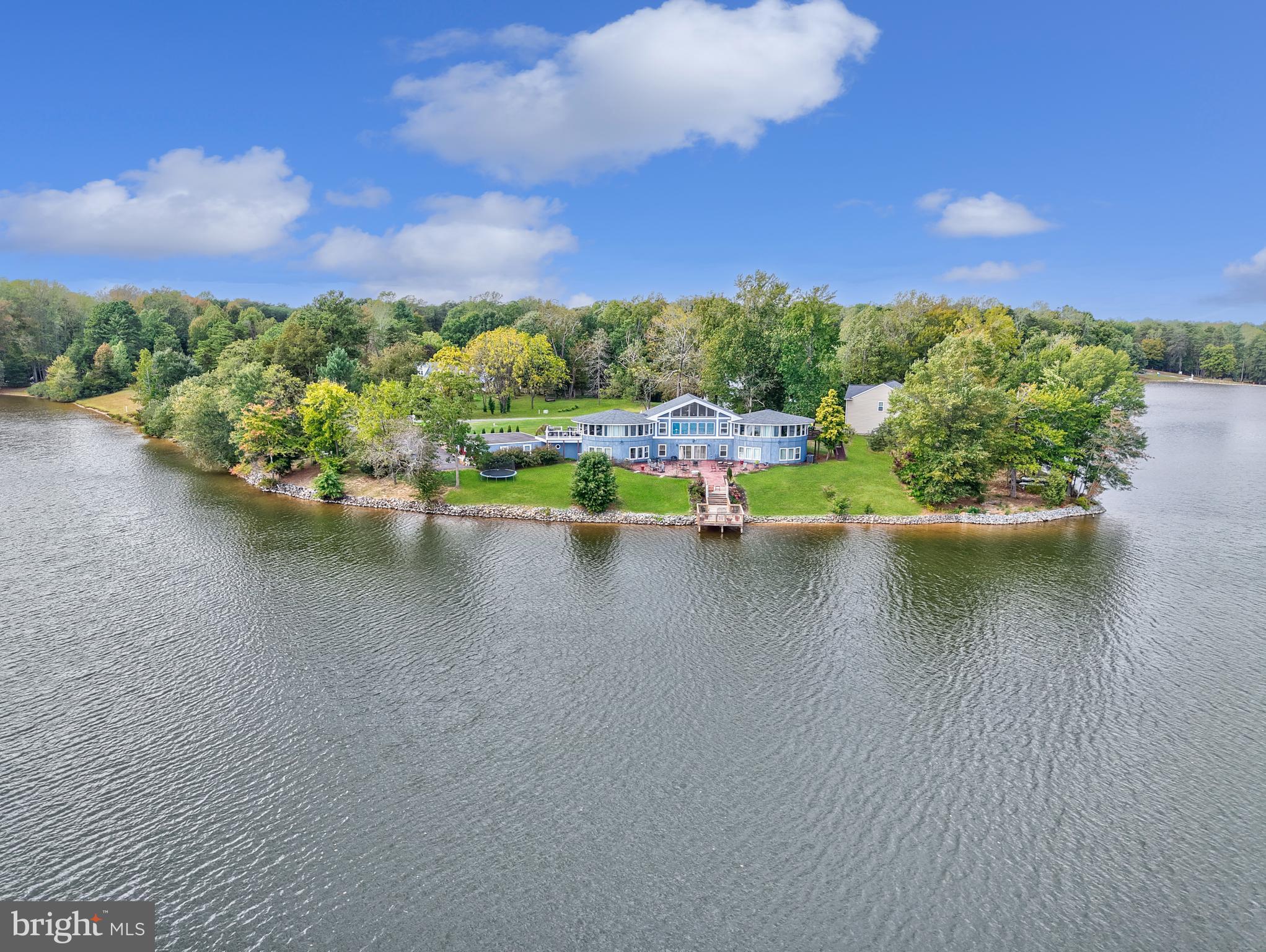 20 Greenvale Court Ruther Glen, VA 22546 - Photo 54 of 65 a view of a lake with houses in the back