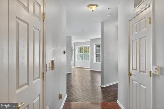 a view of an entryway with wooden floor