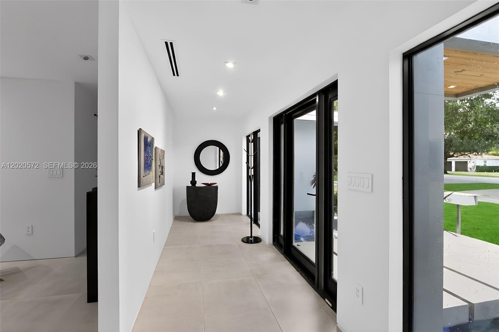 439 Hardee Road Coral Gables, FL 33146 - Photo 3 of 35 a view of a hallway with windows