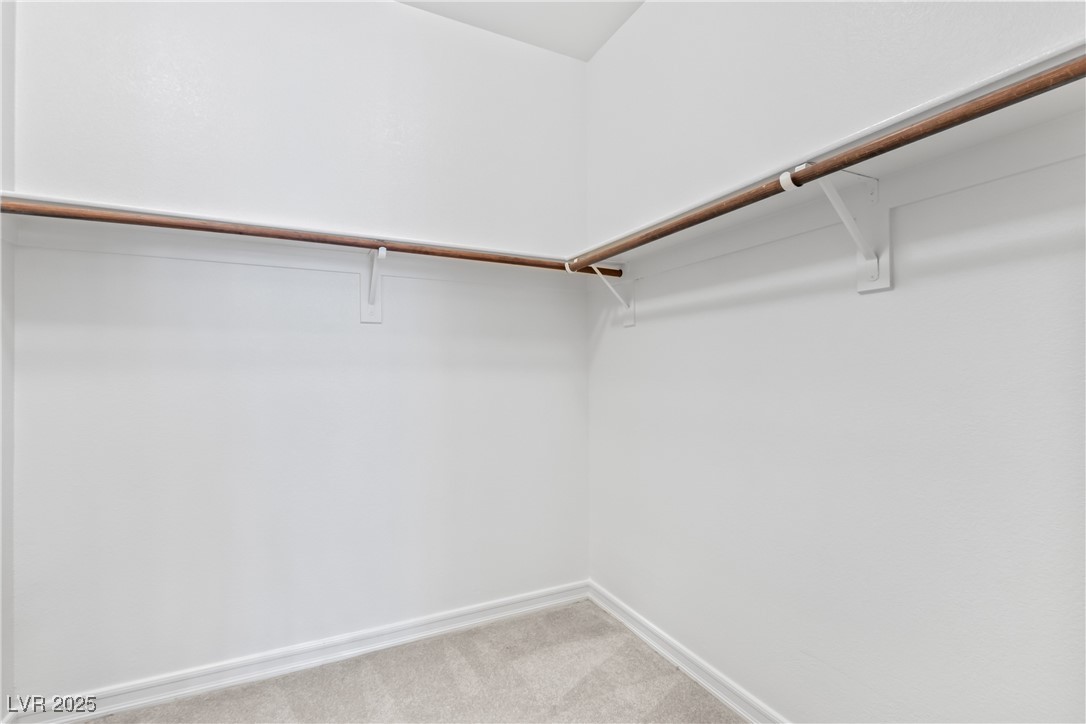 58 Contrada Fiore Drive Henderson, NV 89011 - Photo 25 of 56 Walk in closet featuring light colored carpet