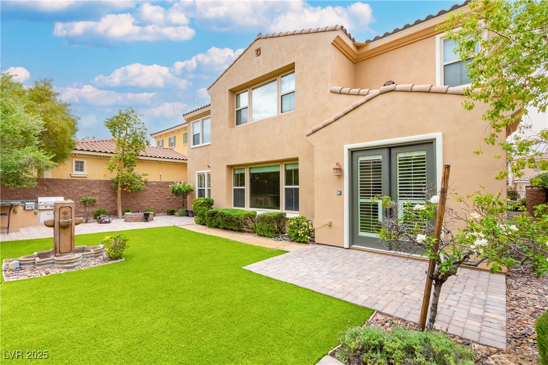 58 Contrada Fiore Drive Henderson, NV 89011 - Photo 53 of 56 Back of property featuring a patio, a tiled roof, stucco siding, and an outdoor kitchen