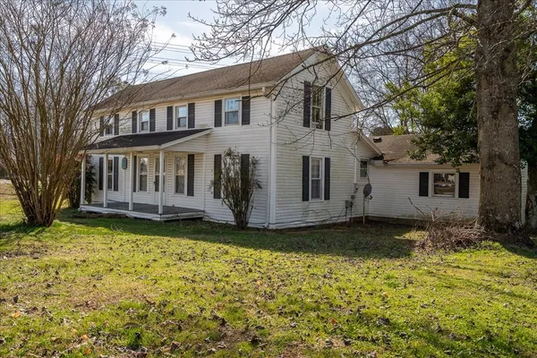 a view of a house with a big yard