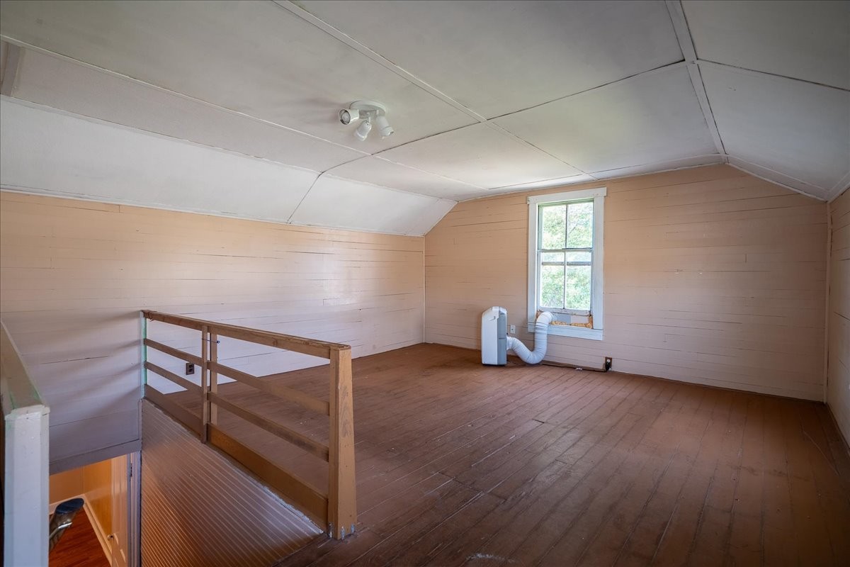 202 Vine Street Loretto, TN 38469 - Photo 26 of 42 a view of an empty room with wooden floor and a window