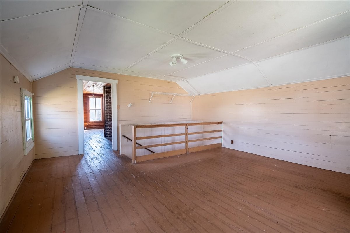202 Vine Street Loretto, TN 38469 - Photo 27 of 42 an empty room with wooden floor and windows