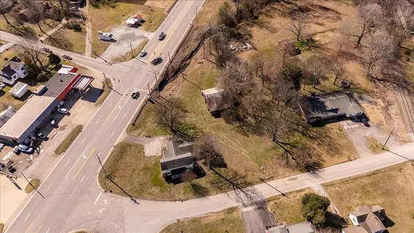 an aerial view of a house with a yard