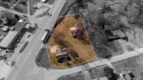 an aerial view of residential house with outdoor space