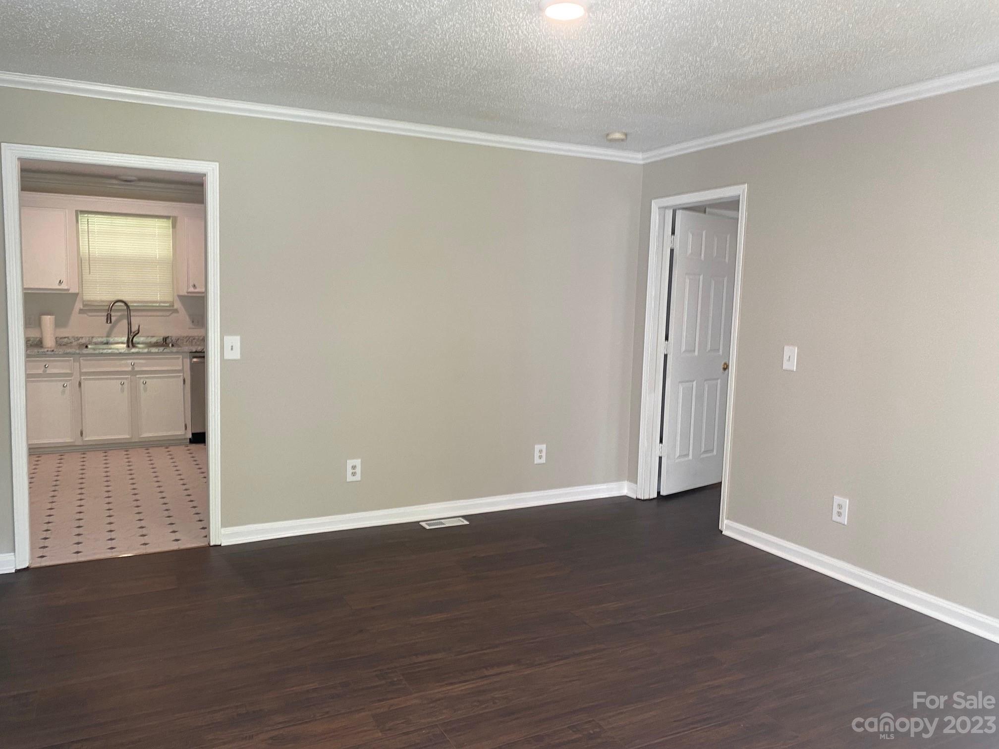 671 Pine Ridge Road Chester, SC 29706 - Photo 11 of 21 a view of an empty room with wooden floor and a window