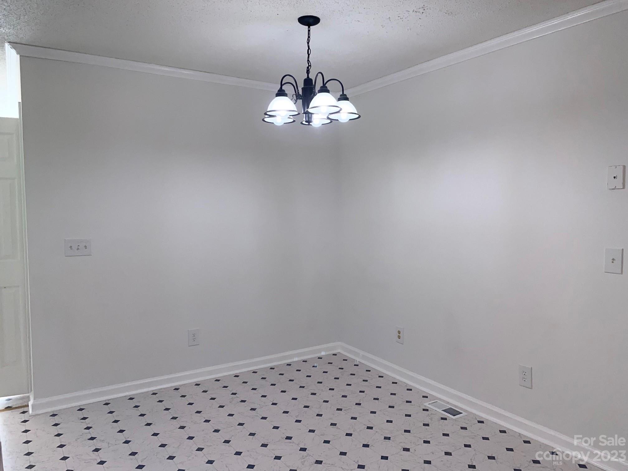 671 Pine Ridge Road Chester, SC 29706 - Photo 6 of 21 a view of a chandelier in an empty room