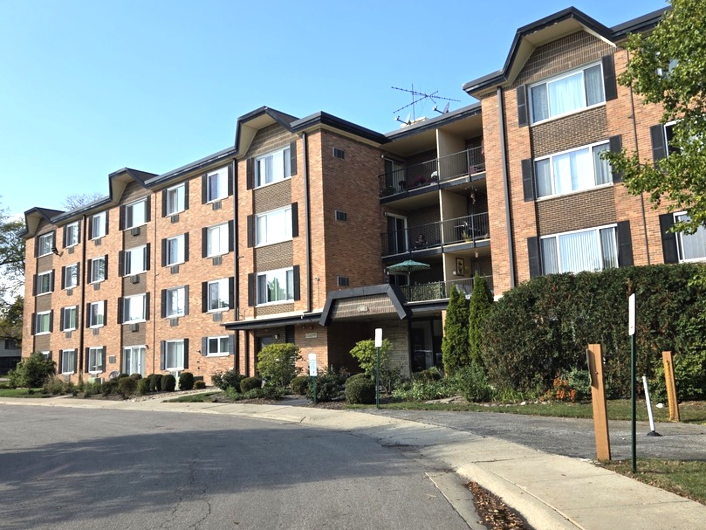 1117 South Old Wilke Road, Unit 206 Arlington Heights, IL 60005 - Photo 1 of 9 a front view of a building
