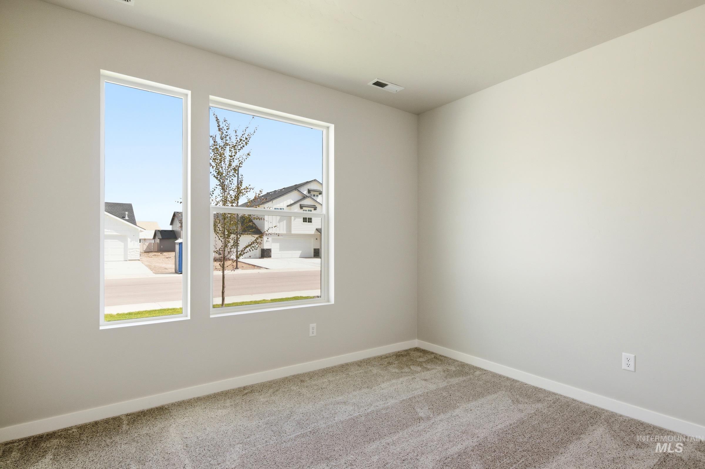 509 Waverly Avenue Middleton, ID 83644 - Photo 11 of 19 Room featuring neutral-toned walls, plush grey carpeting, and white baseboards