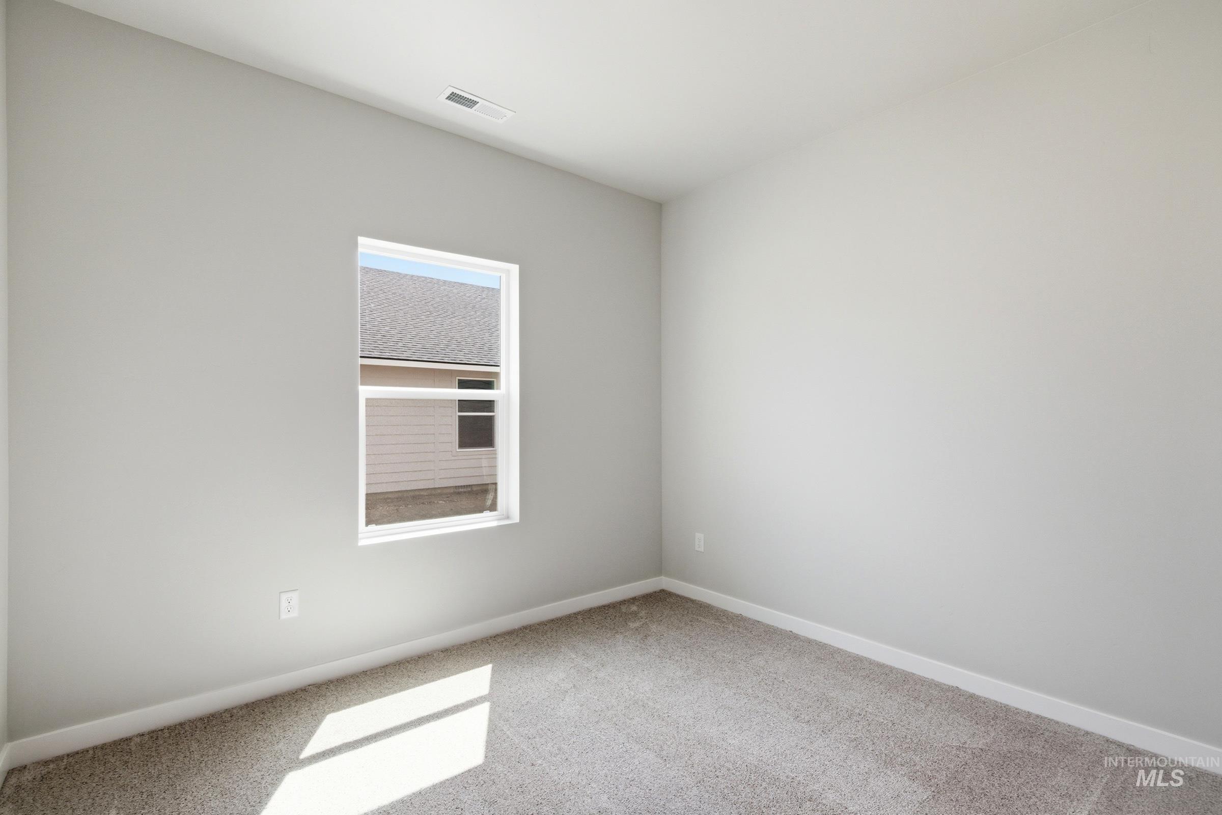 509 Waverly Avenue Middleton, ID 83644 - Photo 12 of 19 Light gray wall finishes with white trim and gray carpeting