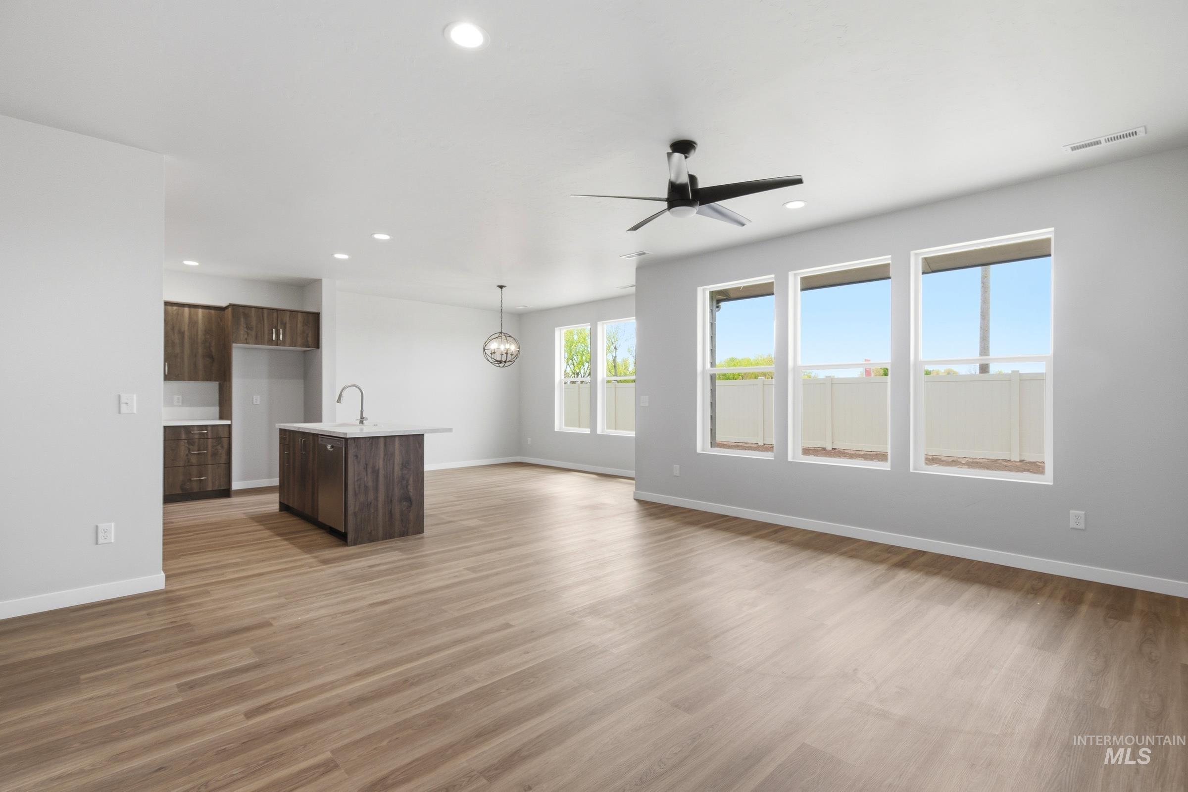 509 Waverly Avenue Middleton, ID 83644 - Photo 10 of 19 Open-concept living space featuring wood-finish flooring, recessed lighting, and a contemporary ceiling fan