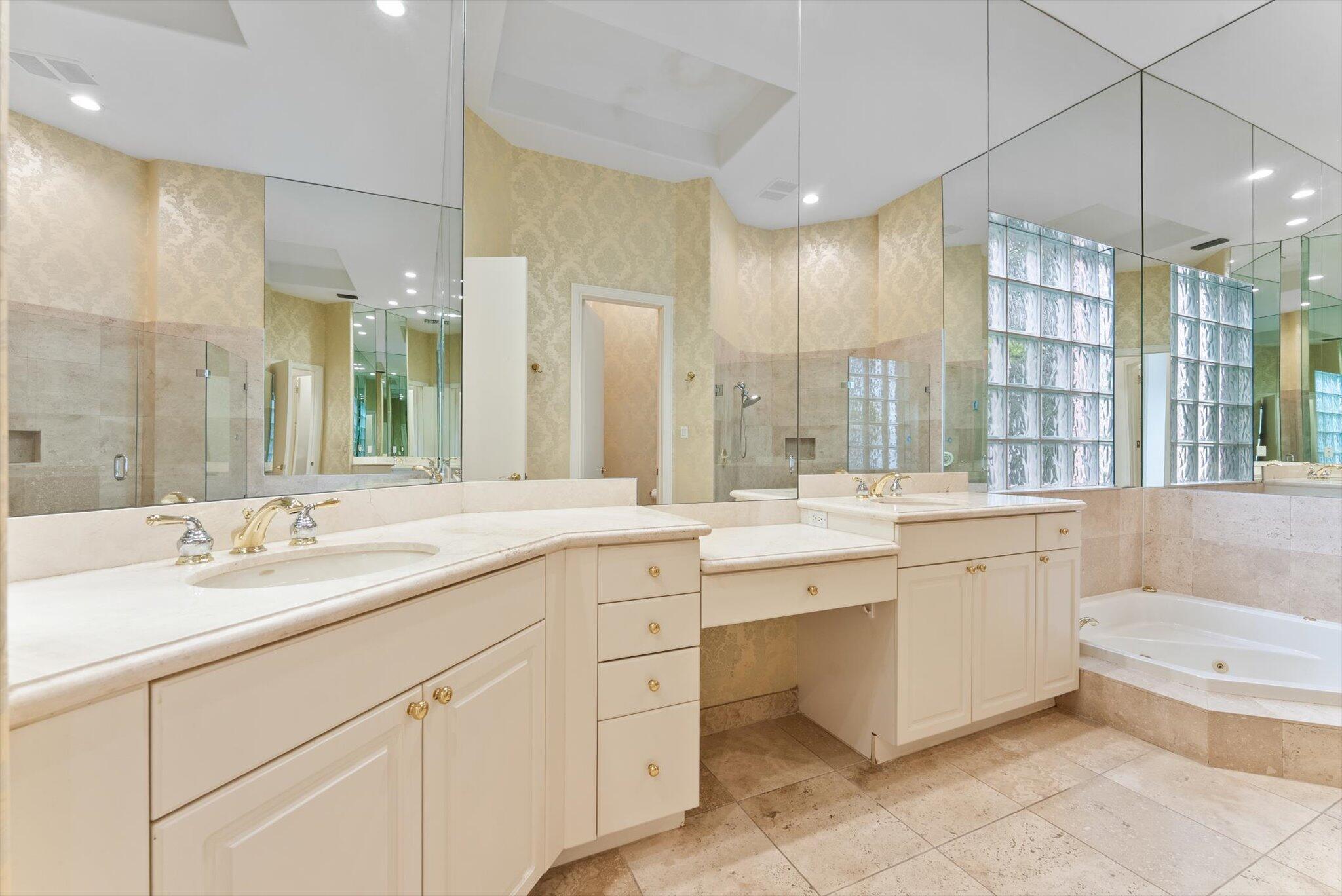 7081 Mallorca Crescent Boca Raton, FL 33433 - Photo 10 of 26 a bathroom with a double vanity sink mirror double and bathtub