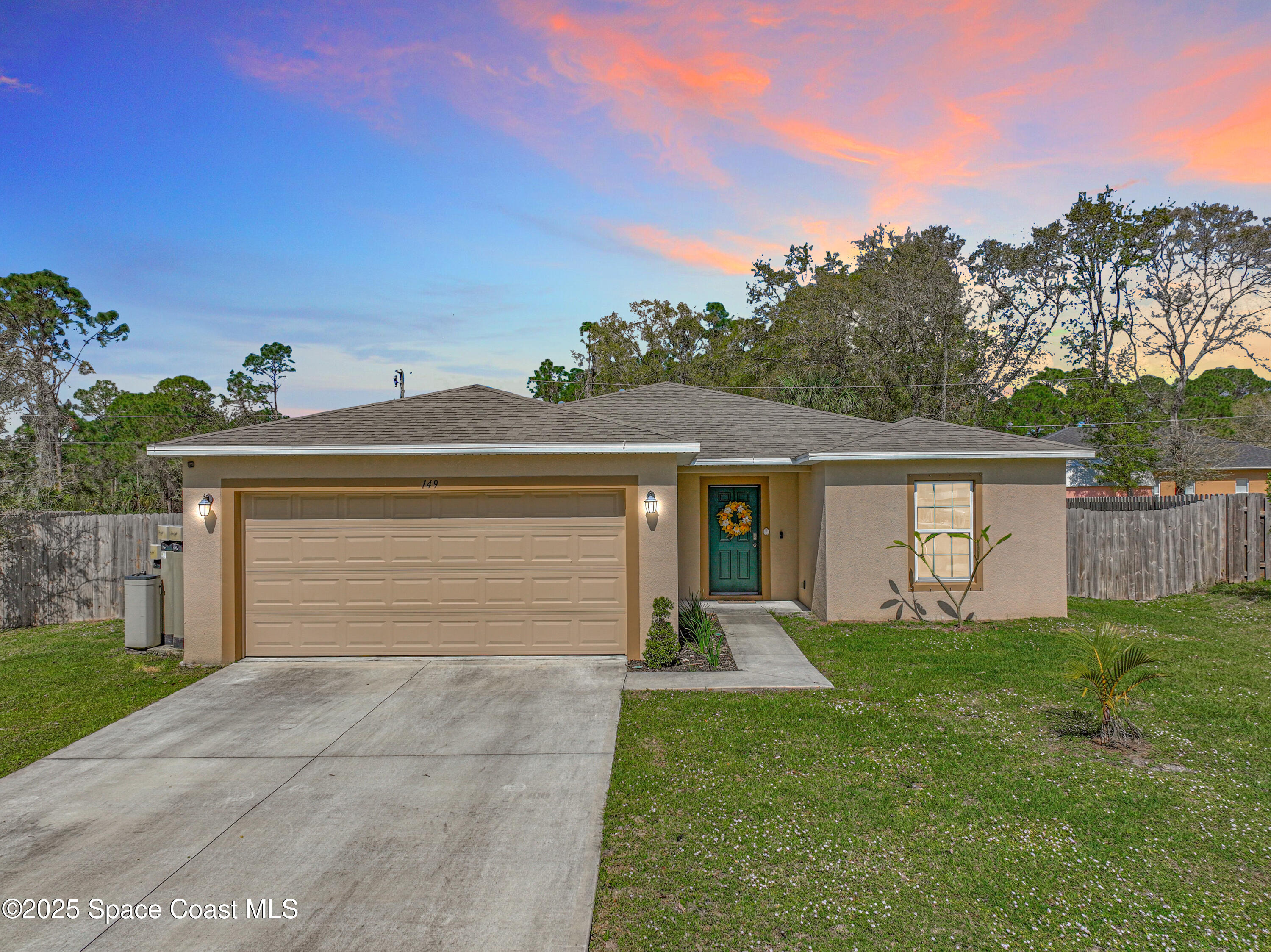 149 Gallopo Road Southwest Palm Bay, FL 32908 - Photo 1 of 36 -149 Gallopo Road SW-4-Twilight Photos