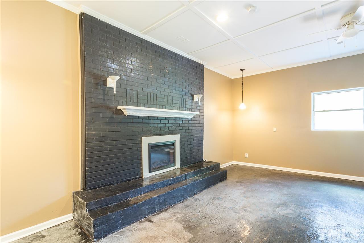 1503 Wiljohn Road Garner, NC 27529 - Photo 11 of 26 a view of an empty room with a fireplace