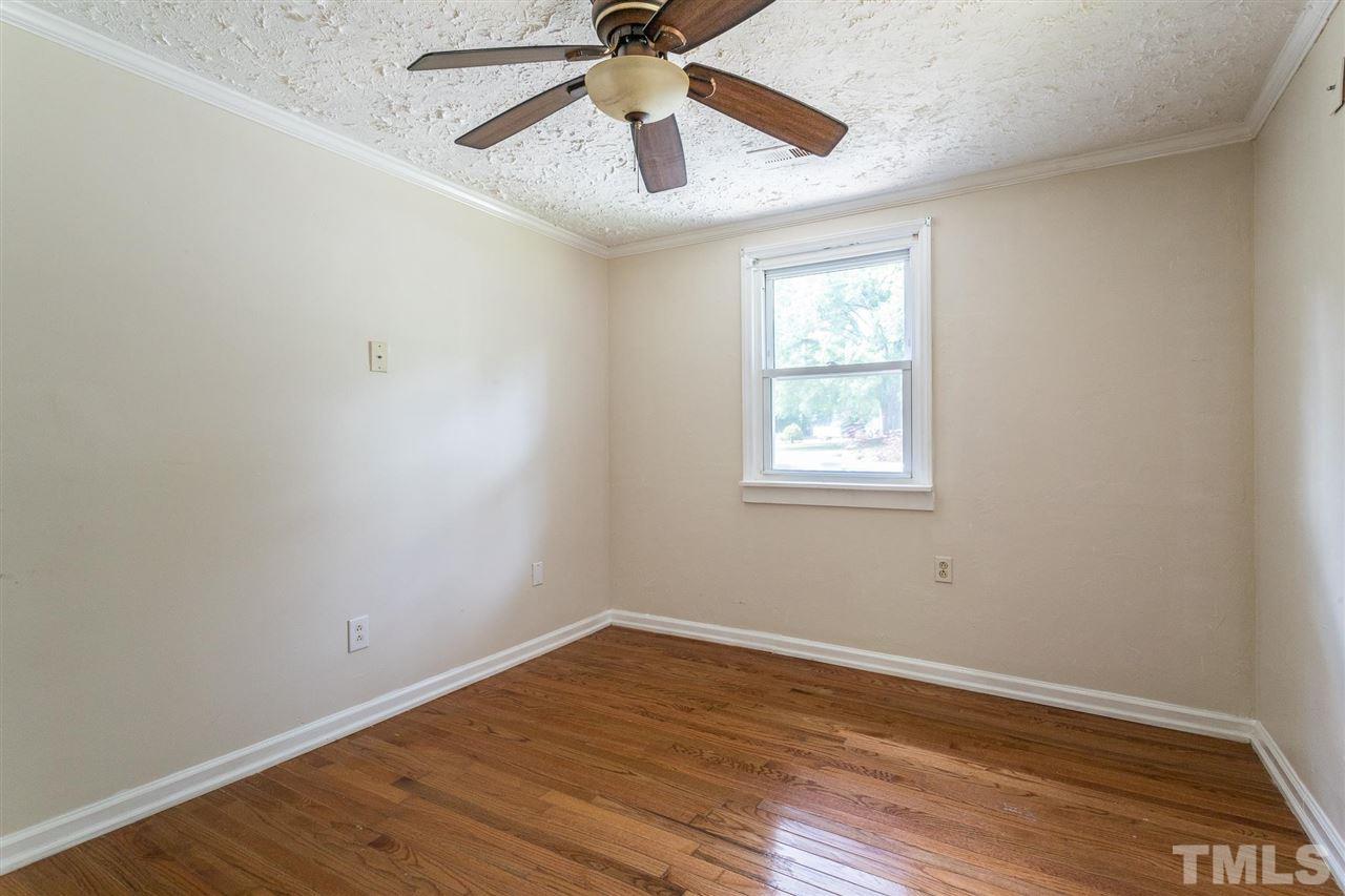1503 Wiljohn Road Garner, NC 27529 - Photo 13 of 26 a view of empty room with wooden floor and fan