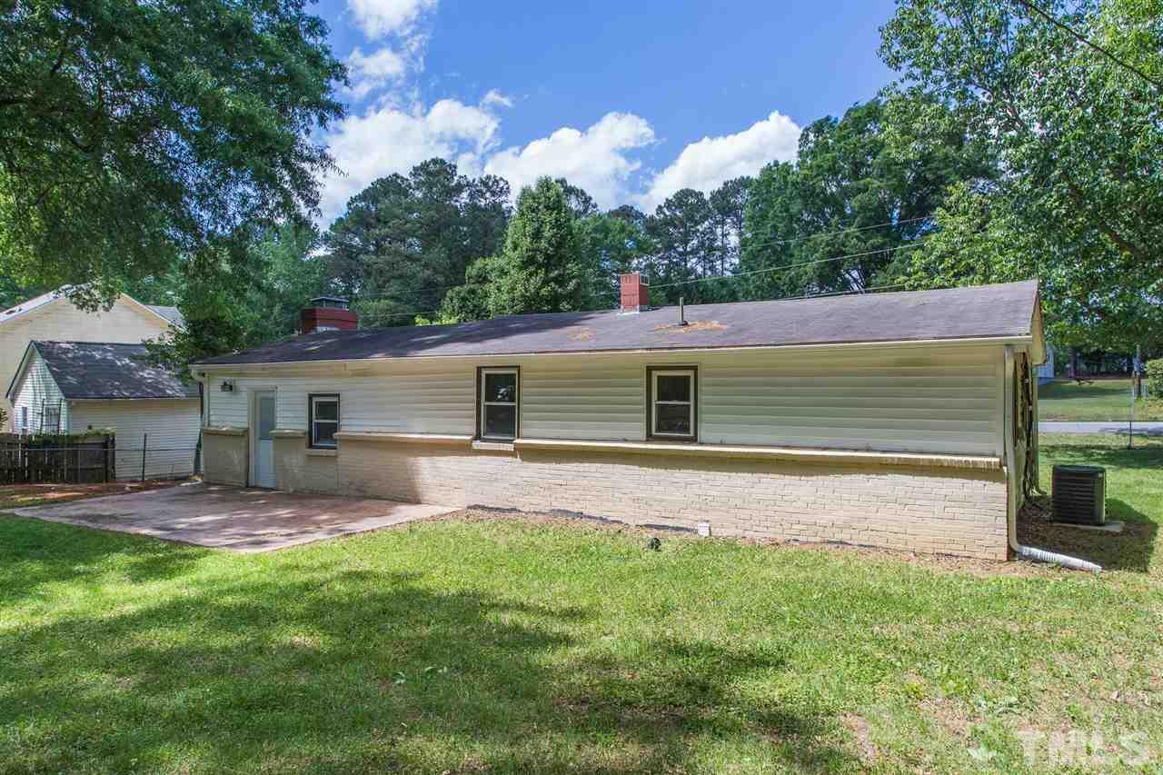 1503 Wiljohn Road Garner, NC 27529 - Photo 22 of 26 a backyard of a house with table and chairs