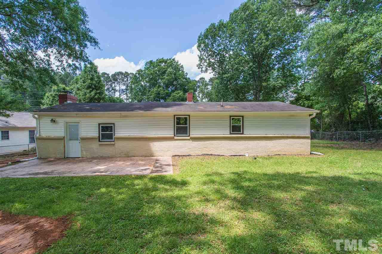1503 Wiljohn Road Garner, NC 27529 - Photo 23 of 26 a front view of house with yard and green space