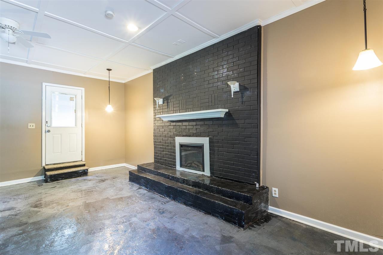 1503 Wiljohn Road Garner, NC 27529 - Photo 10 of 26 a living room with a fireplace