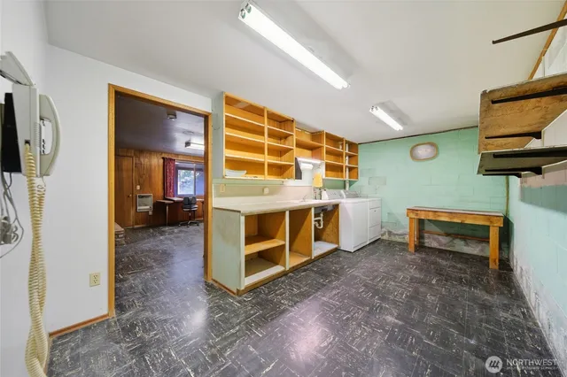 a view of a livingroom with furniture and a flat screen tv