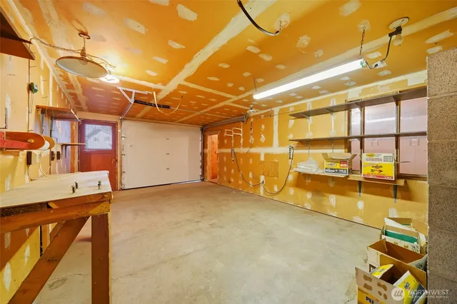 a view of a garage with wooden floor