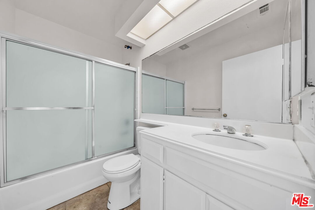 820 West Compton Boulevard, Unit 17 Compton, CA 90220 - Photo 25 of 50 a bathroom with a sink a toilet and shower