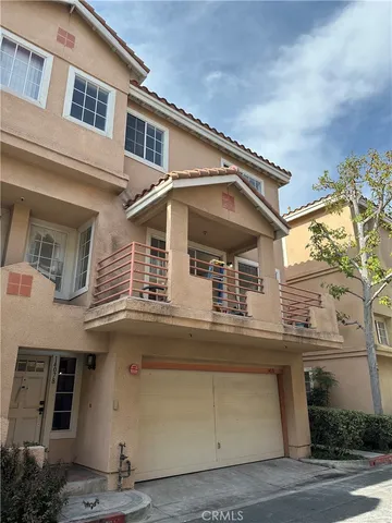 a view of a white building with large windows