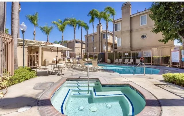 a view of a swimming pool with a patio