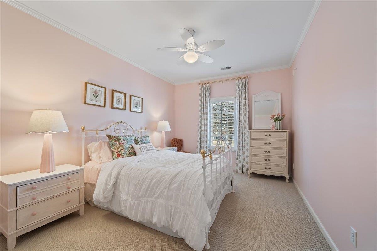 9455 Johnson Rd Extension Germantown, TN 38139 - Photo 25 of 40 Bedroom featuring ornamental molding, light colored carpet, and ceiling fan