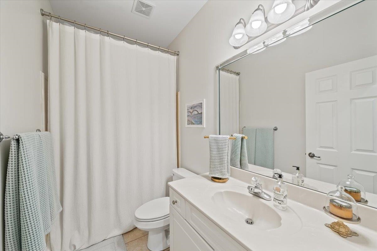 9455 Johnson Rd Extension Germantown, TN 38139 - Photo 30 of 40 Bathroom featuring a shower with shower curtain and vanity