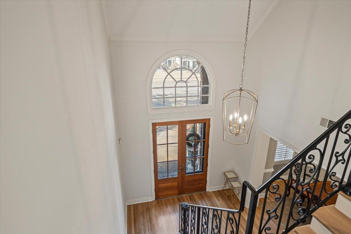 9455 Johnson Rd Extension Germantown, TN 38139 - Photo 4 of 40 Entryway with french doors, wood finished floors, a high ceiling, and suspended lighting