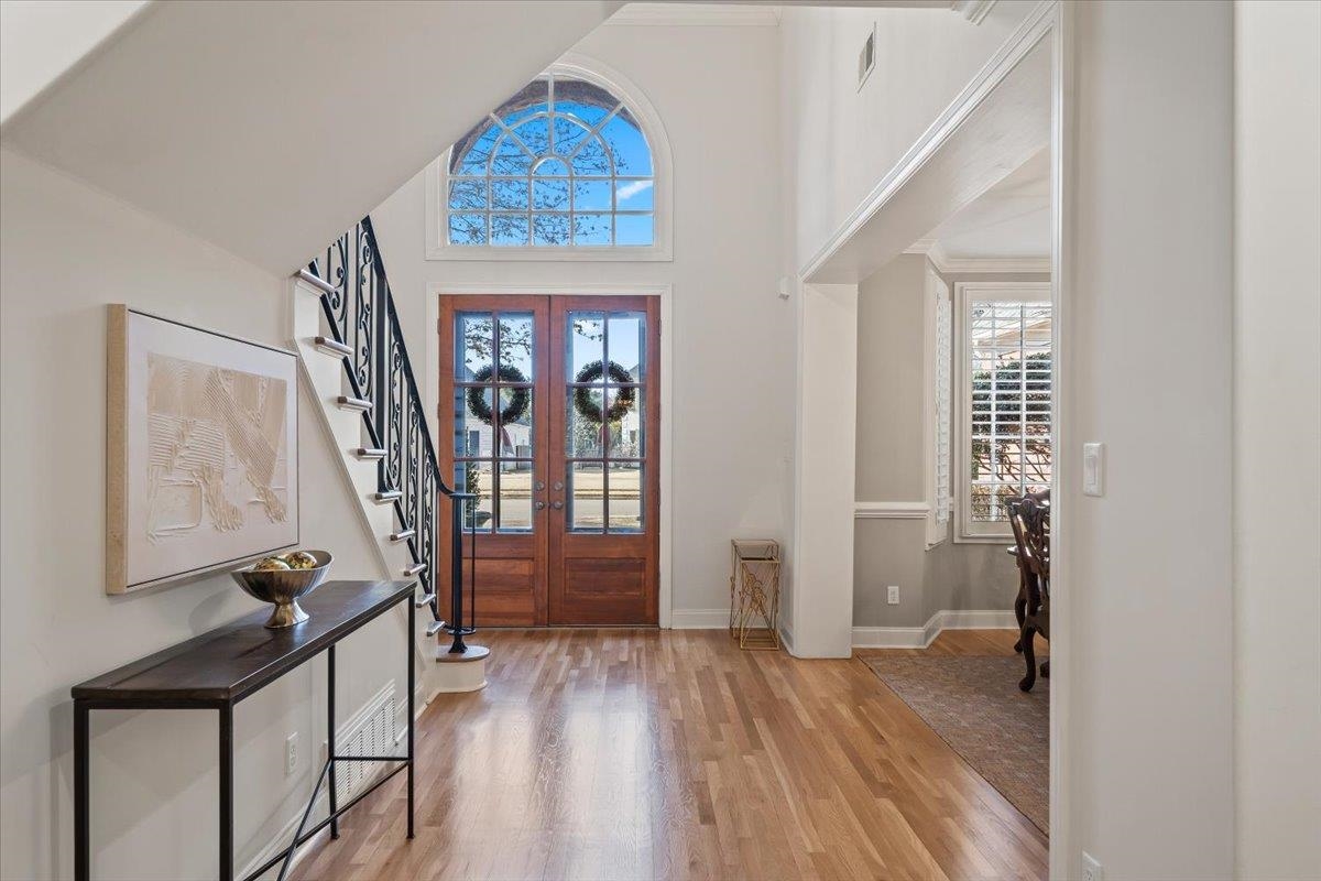 9455 Johnson Rd Extension Germantown, TN 38139 - Photo 6 of 40 Entryway with light wood-style flooring, a high ceiling, plenty of natural light, and french doors