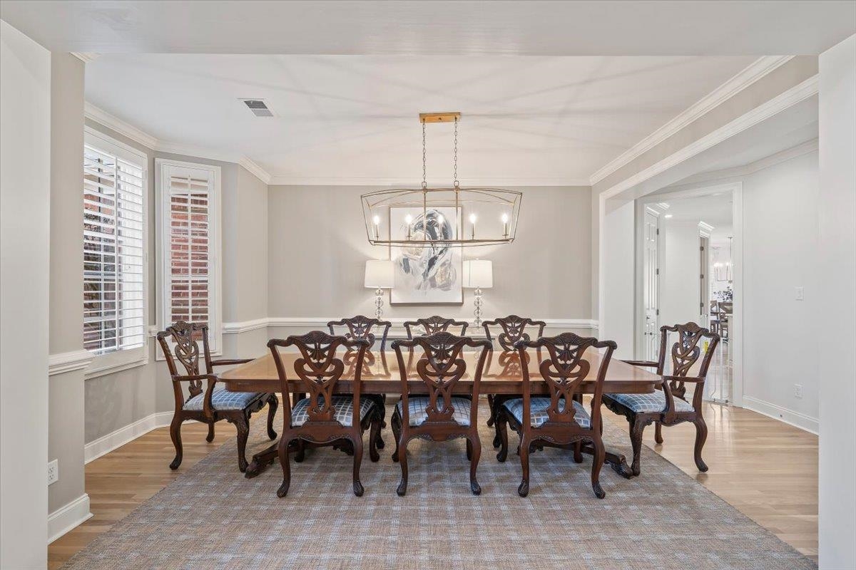 9455 Johnson Rd Extension Germantown, TN 38139 - Photo 7 of 40 Dining room featuring light wood finished floors, ornamental molding, and hanging lights