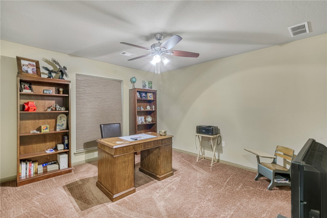 9945 Oxford Cemetery Road Madisonville, TX 77864 - Photo 23 of 42 Office area with light colored carpet and a ceiling fan