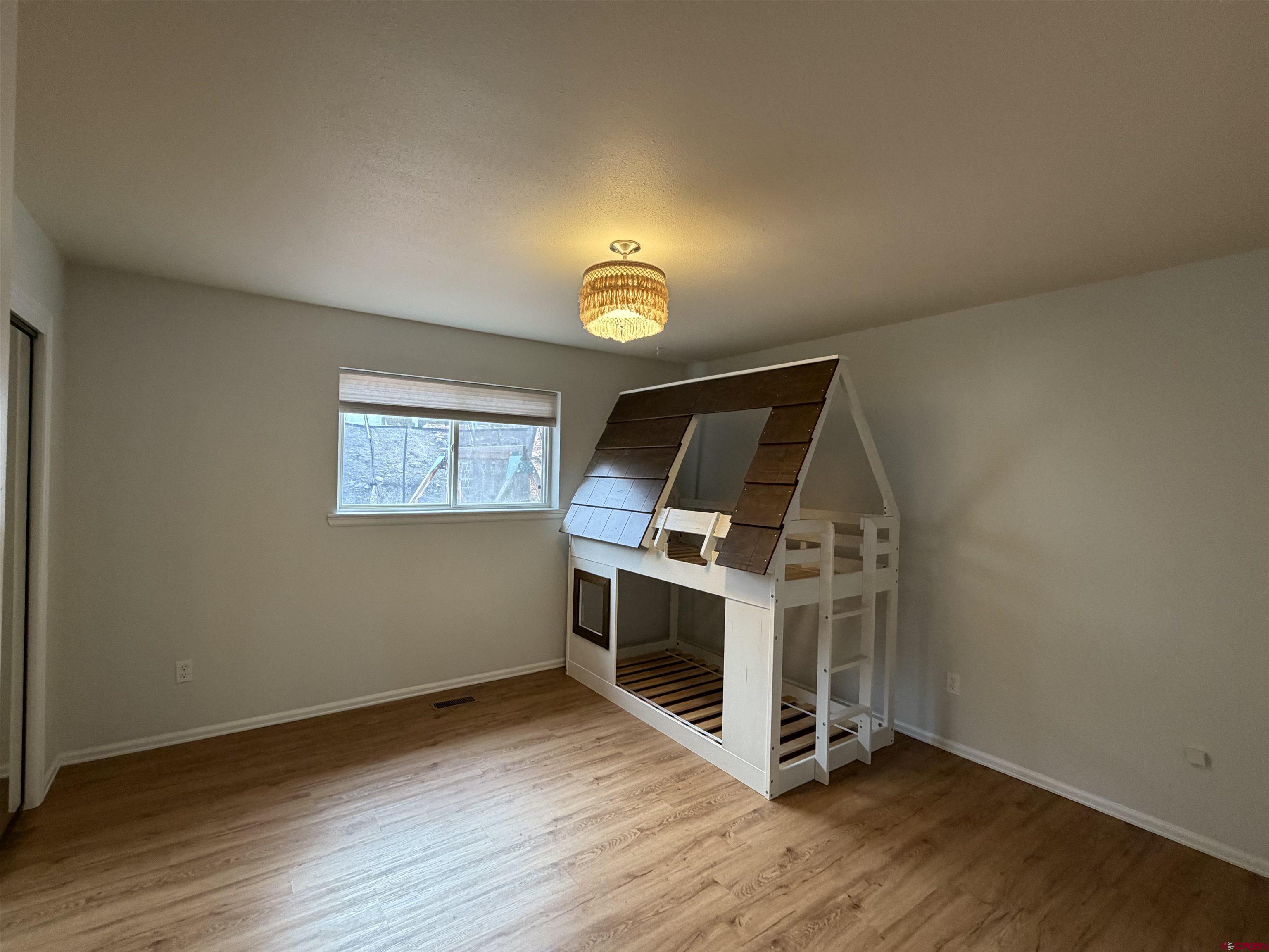 188 Bert Street Delta, CO 81416 - Photo 21 of 36 a view of kitchen and wooden floor