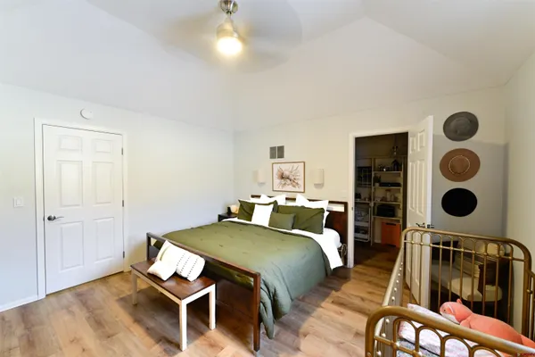 a bedroom with a bed and cabinets