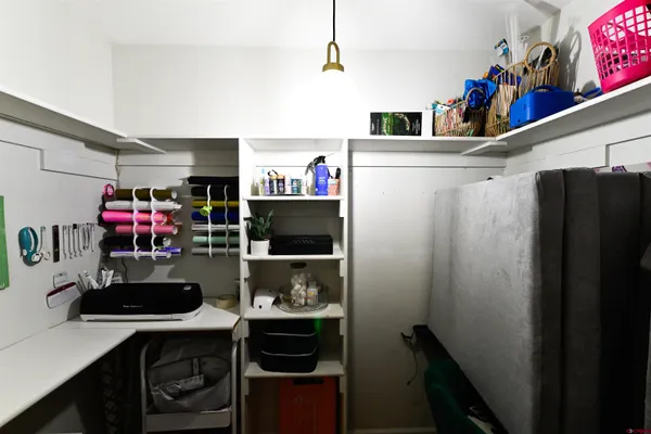 a kitchen with a refrigerator and a stove