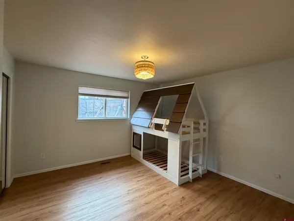 a view of kitchen and wooden floor