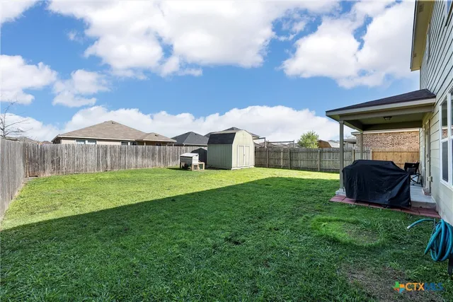 a view of a backyard with a garden