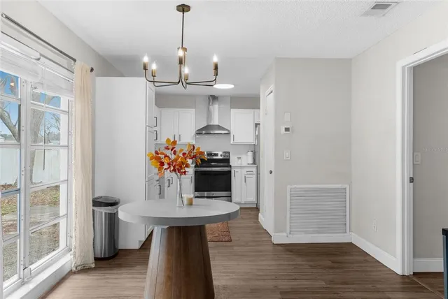 a view of a kitchen and an entryway