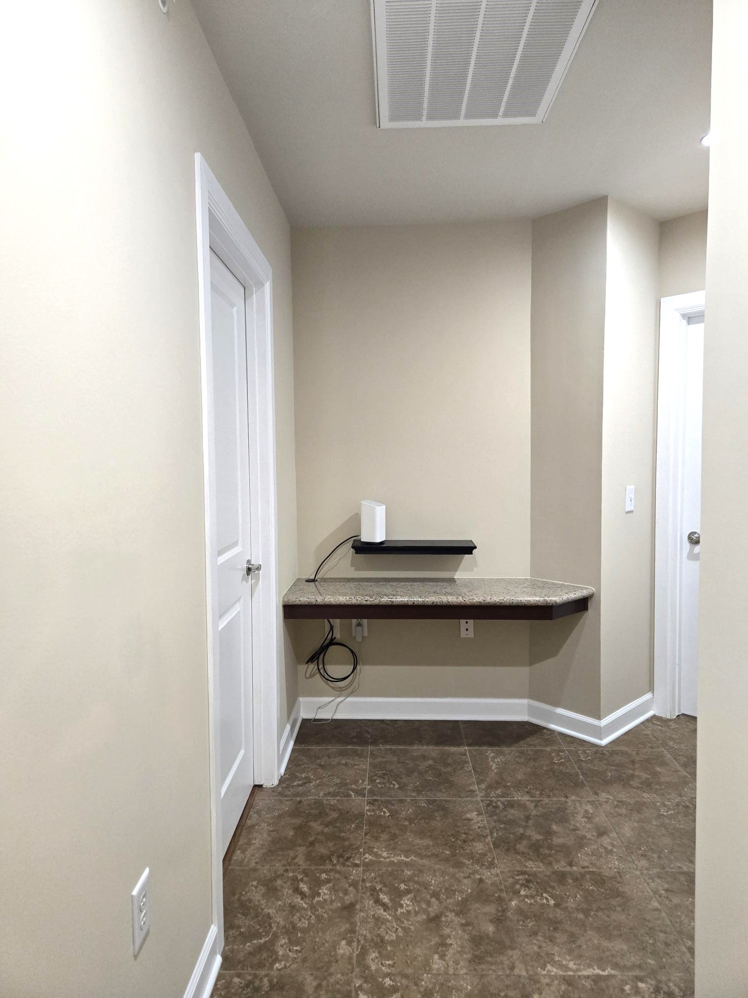 1900 Genesee Street, Unit 207 Houston, TX 77006 - Photo 36 of 50 There is a convenient granite top desk in hall nook, close to bedrooms and secondary bath.