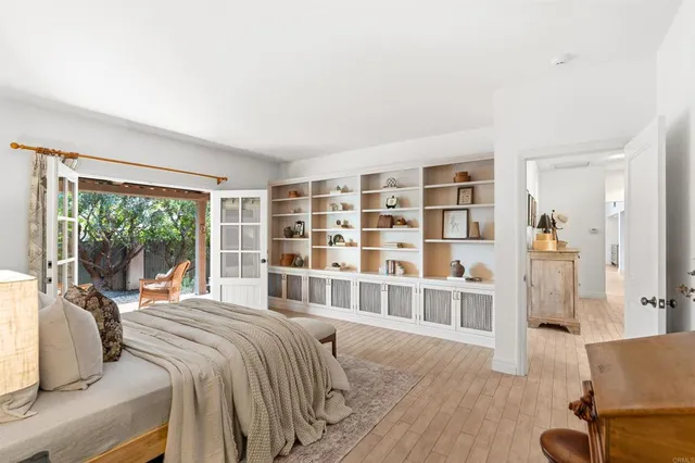 a bathroom with a granite countertop sink and a bathtub