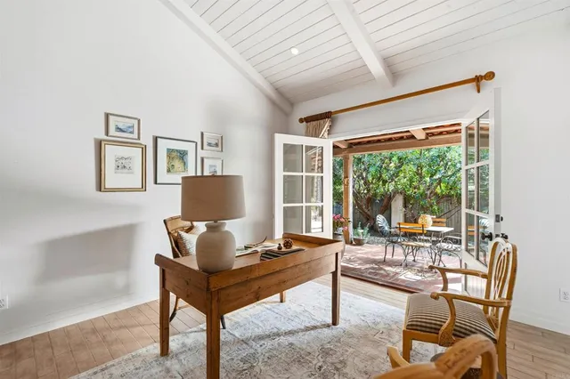 a view of a patio with table and chairs and potted plants