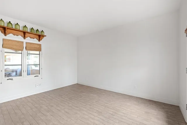 a view of a patio with a table chairs and a backyard